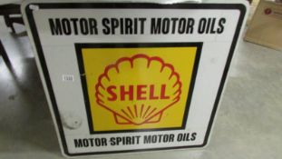 A Shell Motor Oil metal sign.