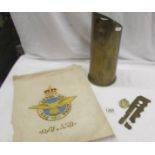A quantity of militaria including old gun shell with R.A.F SSQ BIRD, R.A.F SSQ Embroidery, R.A.