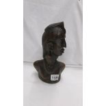 A carved wood African male bust.