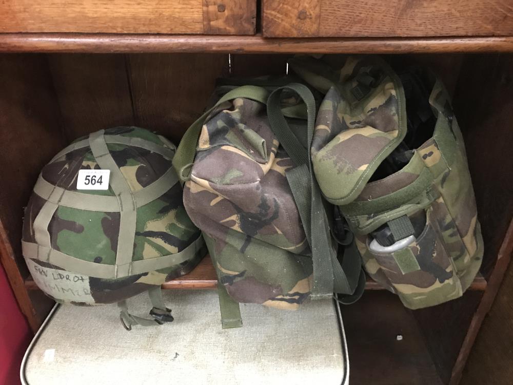 A camouflage helmet and other camouflage items.