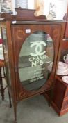 A cabinet bearing Chanel No. 5 signage.