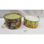 2 tin drums including Mickey Mouse.
