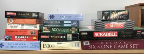 A selection of board games & jigsaw puzzles