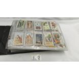 An album of Wills cigarette cards including Russian Architecture, Flowers and trees etc., (no sets).