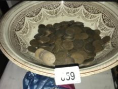 A bowl of old pennies