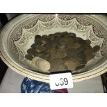 A bowl of old pennies