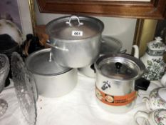 4 good quality aluminium pans with lids