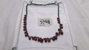 A ruby and emerald necklace.