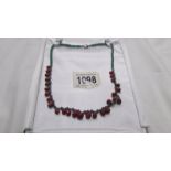 A ruby and emerald necklace.