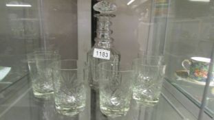 A cut glass decanter and 6 whisky tumblers.