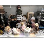 A collection of dolls including porcelain example & a Chiltern black baby doll