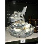 A water feature depicting wolves