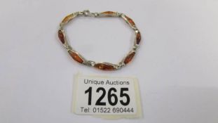 A silver and amber bracelet.