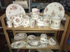 Two shelves of Royal Crown Derby including Posies, Staffordshire China, Wedgwood etc.