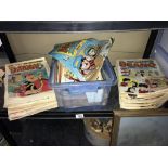 A shelf of Dandy and Beano comics