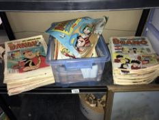 A shelf of Dandy and Beano comics