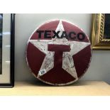 A retro painted metal Texaco sign