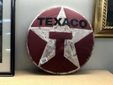 A retro painted metal Texaco sign