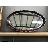 An Edwardian walnut framed bevel edge mirror with blue & silver decoration ****Condition