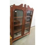 A Victorian mahogany glazed book case.