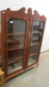 A Victorian mahogany glazed book case.