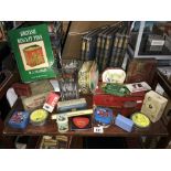 A collection of collectors tins and book on biscuit tins