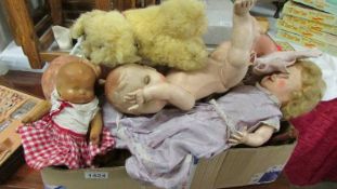 A box of old dolls.