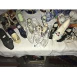 A larger quantity of cabinet shoes - glass, porcelain etc.