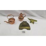 A miniature copper teapot, miniature copper flagon, miniature brass anvil and a brass inkwell.