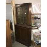 A lead glazed corner cabinet.