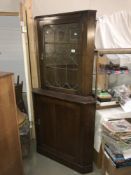 A lead glazed corner cabinet.