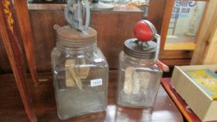 2 vintage churn jars.