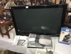 A Panasonic Viera 37 TV inch with remote and instructions, and a DVD player,