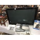 A Panasonic Viera 37 TV inch with remote and instructions, and a DVD player,