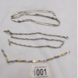 A silver chain (37 grams),another silver chain (20 grams) and a white and yellow metal bracelet.