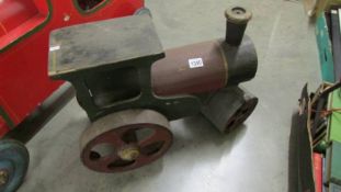 A metal and wood steam roller.