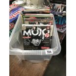 A box of miscellaneous music magazines including Record Collector, Mojo, Total Guitar etc.