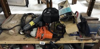 A shelf of electrical tools & vice etc.