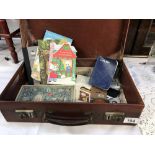 A small vintage leather suitcase & contents