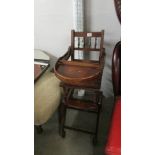 A vintage metamorphic high chair.