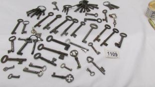 Approximately 70 old metal keys.