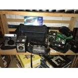 A shelf of cameras