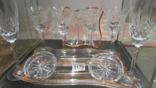 3 contemporary glass dishes and 2 champagne flutes.