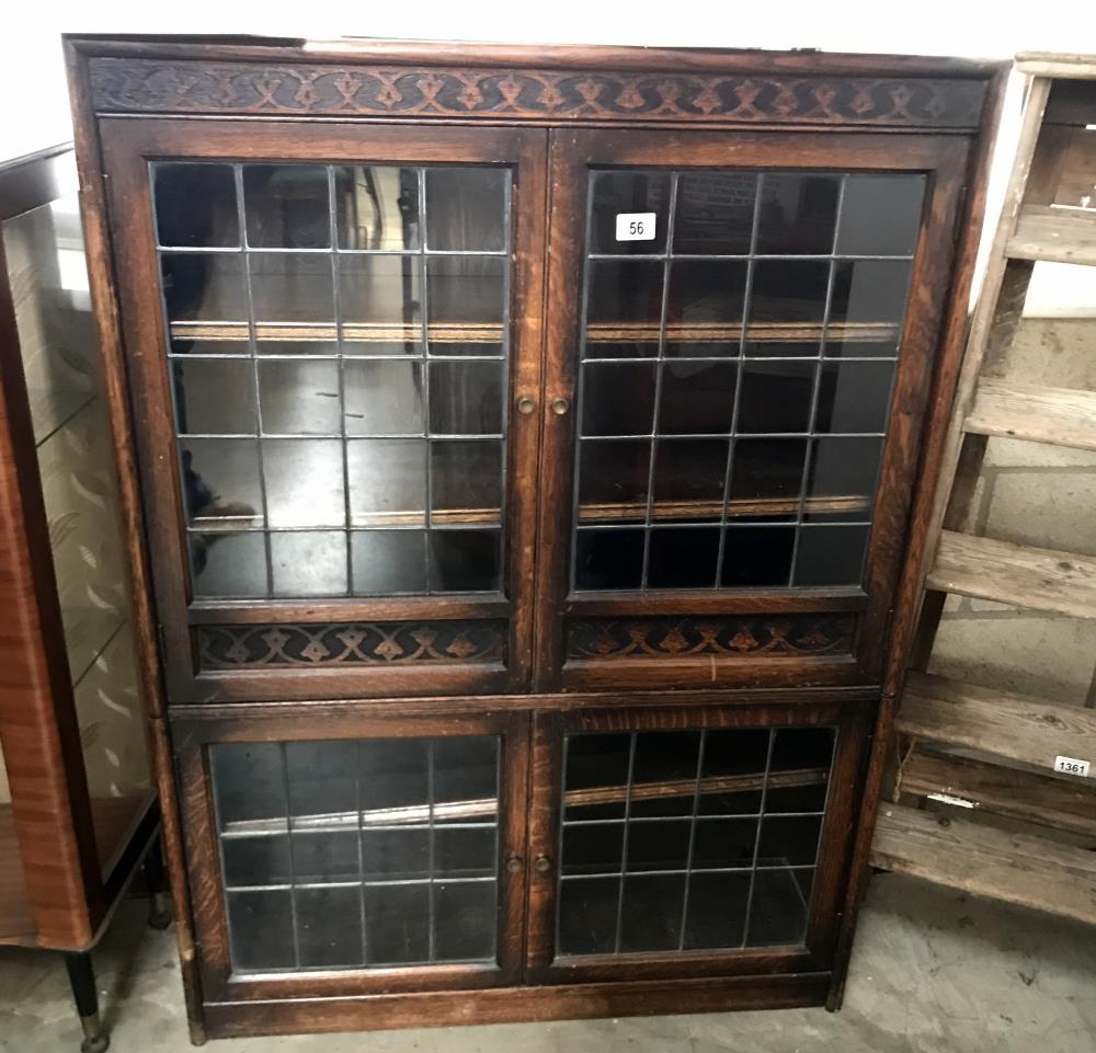 An oak lead glazed bookcase