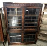 An oak lead glazed bookcase