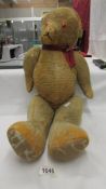 A large straw filled jointed Teddy bear, a/f.