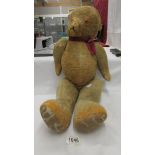 A large straw filled jointed Teddy bear, a/f.