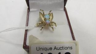 A 2 stone yellow gold ring shaped as a fly and set 2 opals, size N half.