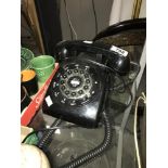 A vintage black bakelite telephone