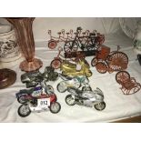 A selection of collectable motorbikes including miniature wire pushbikes